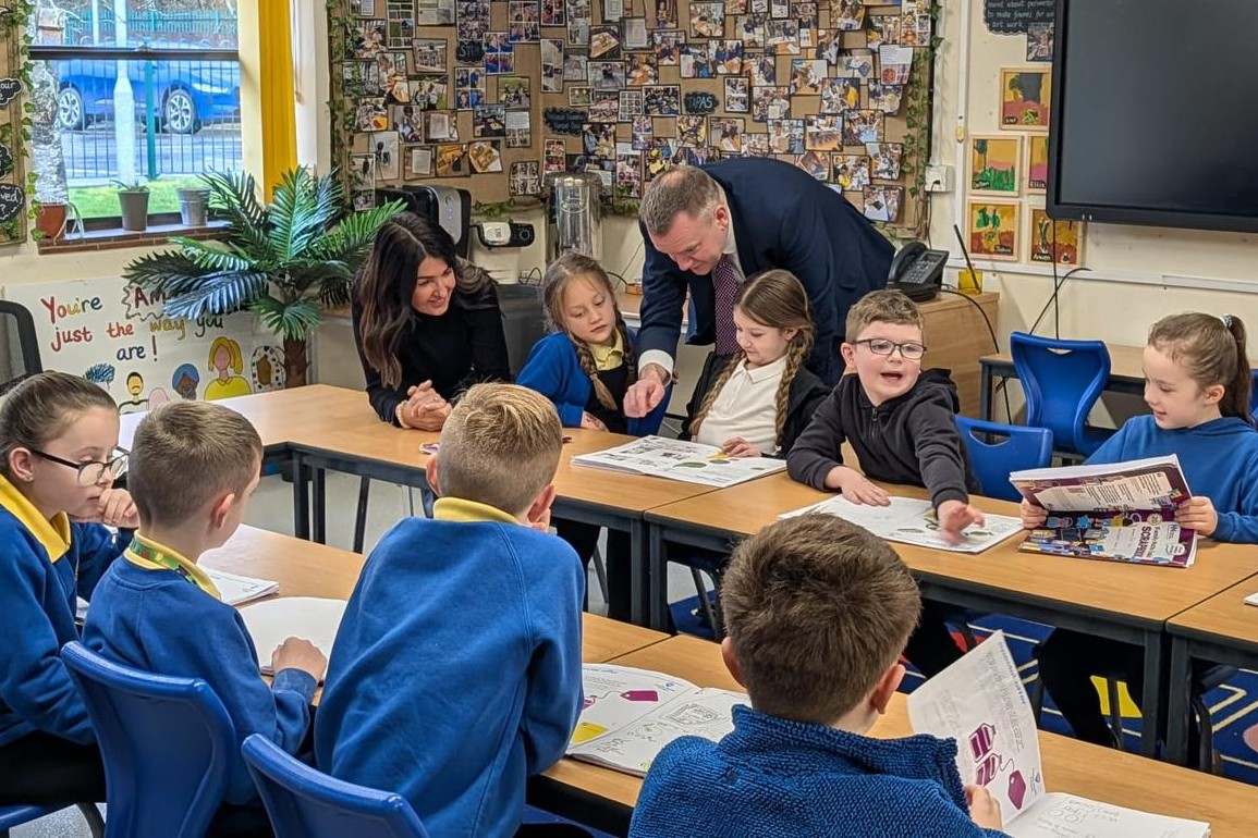 MP Nick Thomas-Symonds with children in a classroom
