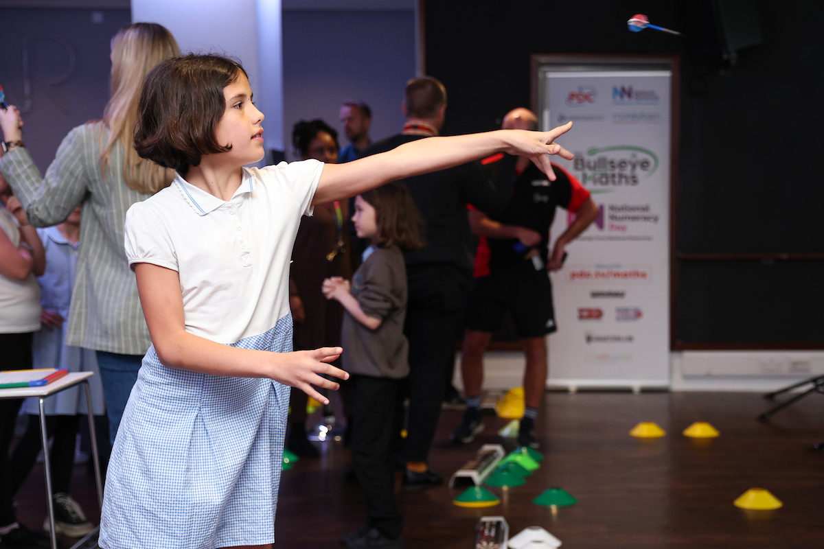 Student throwing a dart