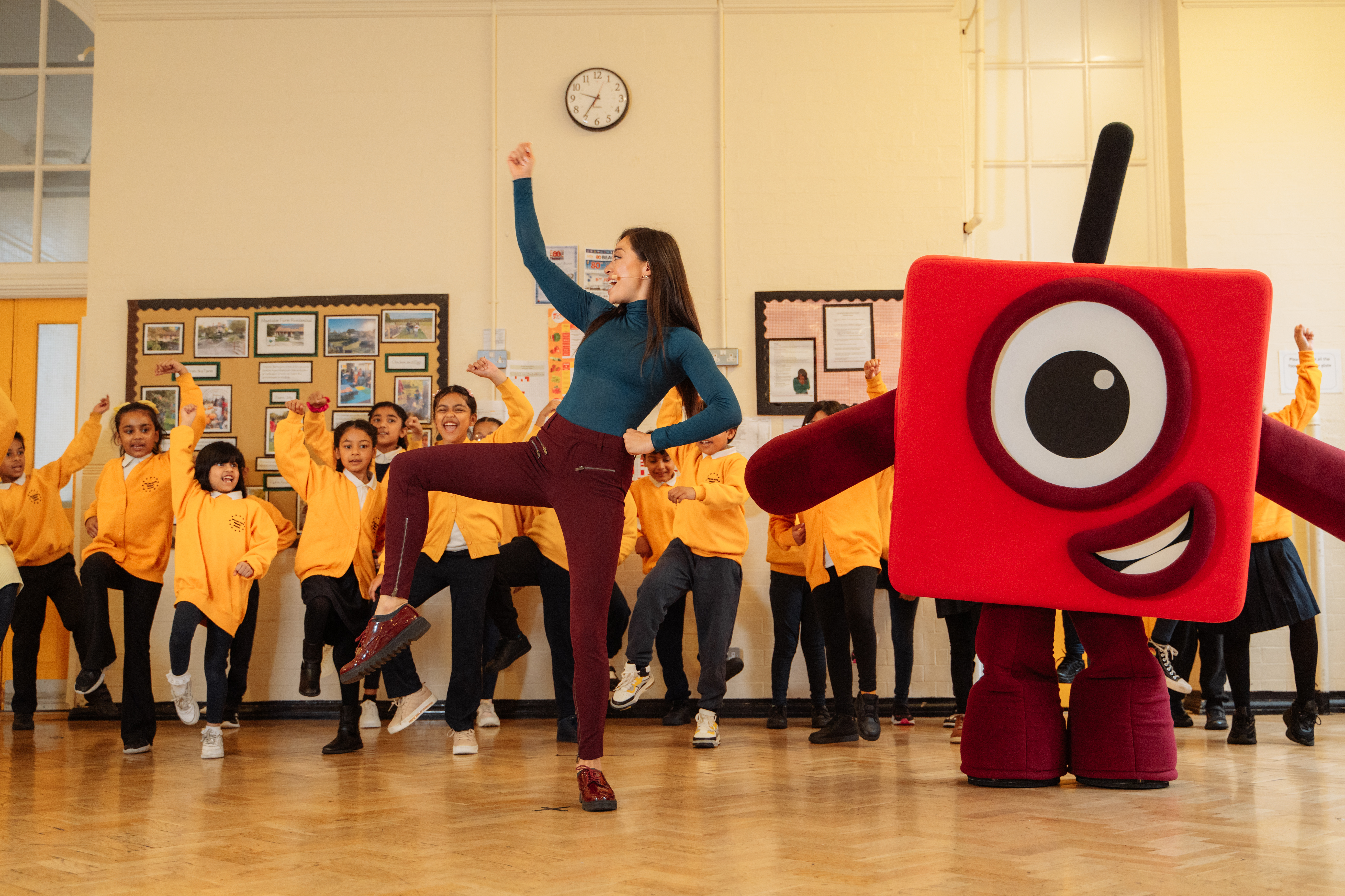 Katya Jones leading children in a dance