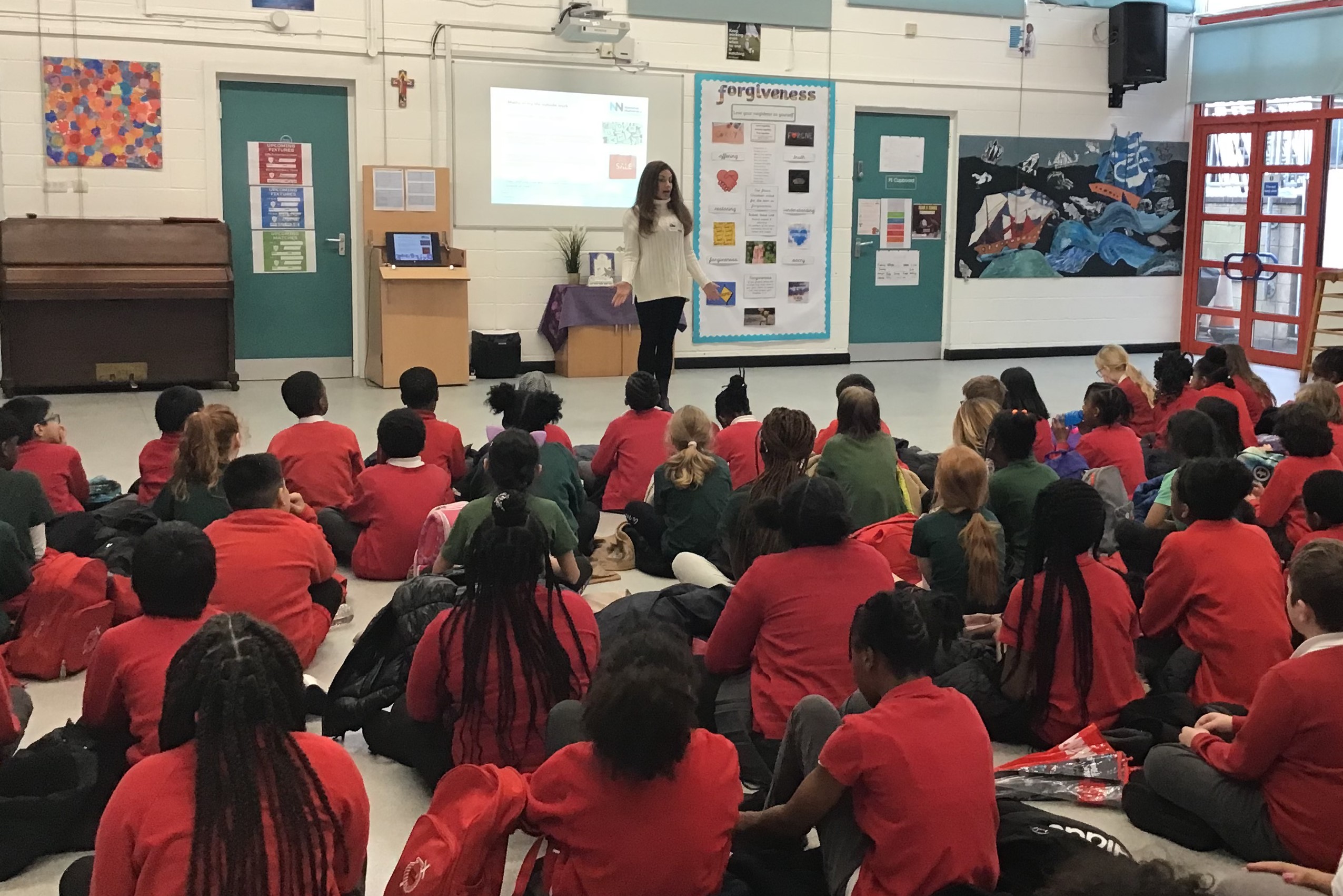 Volunteer leading an assembly