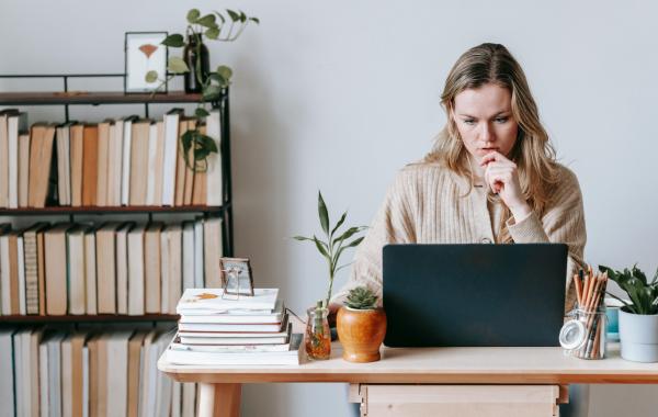 Person sitting at a desk with a computer