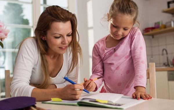 A mother and daughter doing maths homework