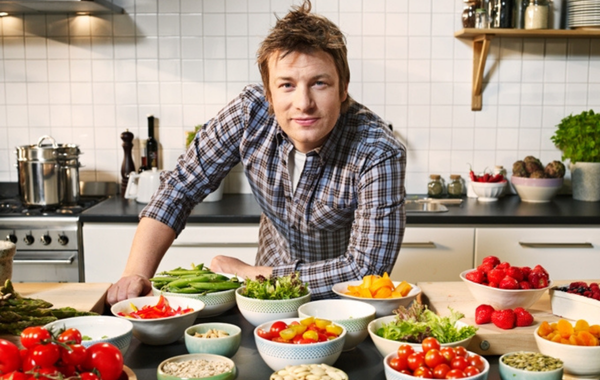 Jamie Oliver with bowls of food