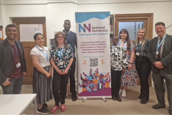 Capital City College Group staff with National Numeracy banner