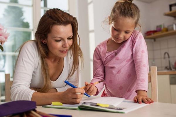 A mother and daughter doing maths homework