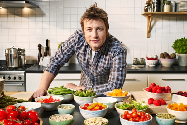 Jamie Oliver with bowls of food