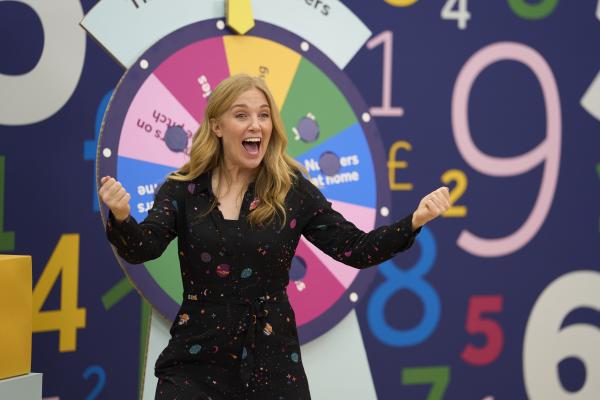 TV presenter Maddie Moate hosting the Wheel of Numbers live assembly